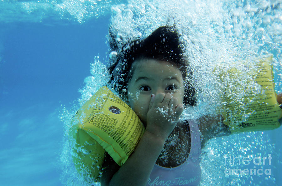 Young Girl Diving In A Swimming Pool Underwater Photograph by Sami Sarkis
