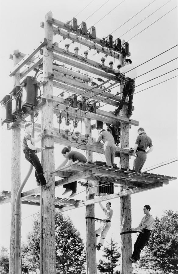 History Photograph - Young Men Working On Telephone Poles by Everett