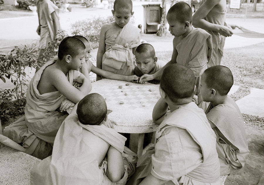 Young Monks Playing Photograph by Shaun Higson