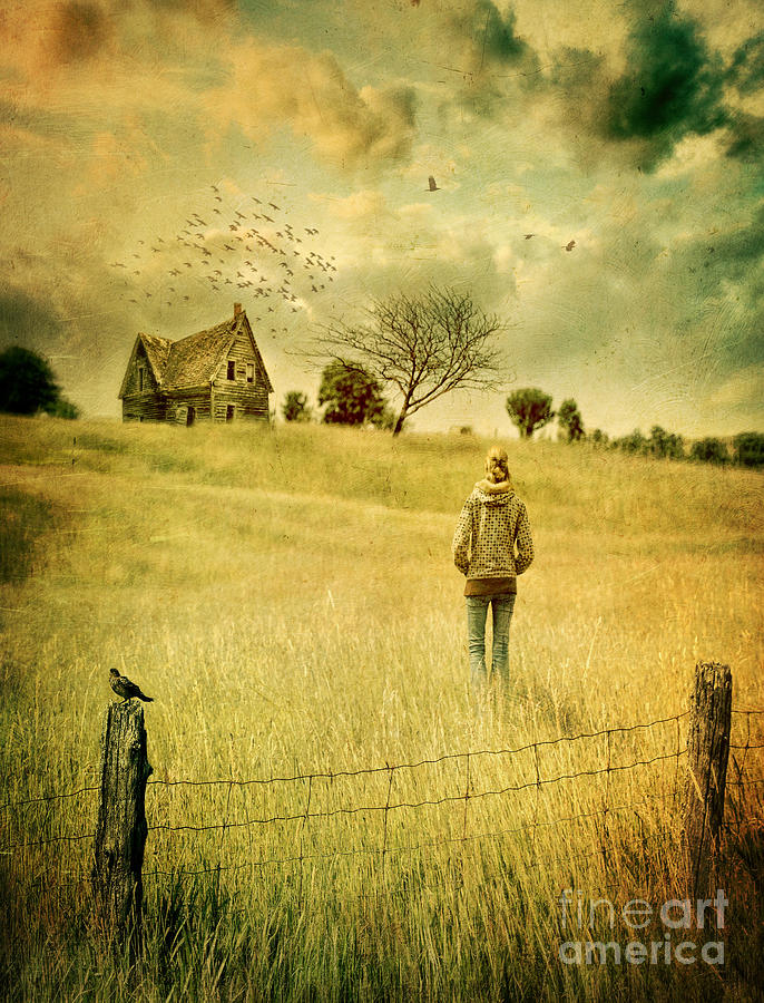 Young woman walking in field towards abandoned house Photograph by Sandra Cunningham