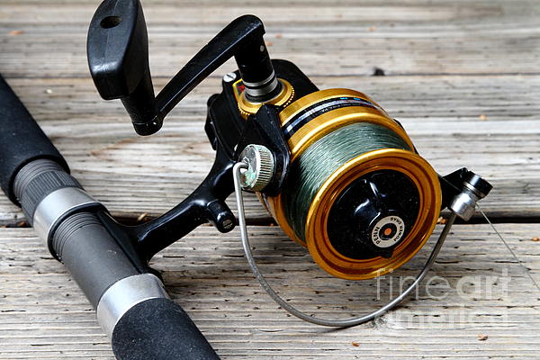 https://images.fineartamerica.com/images-medium/fishing-rod-and-reel-7d13549-wingsdomain-art-and-photography.jpg