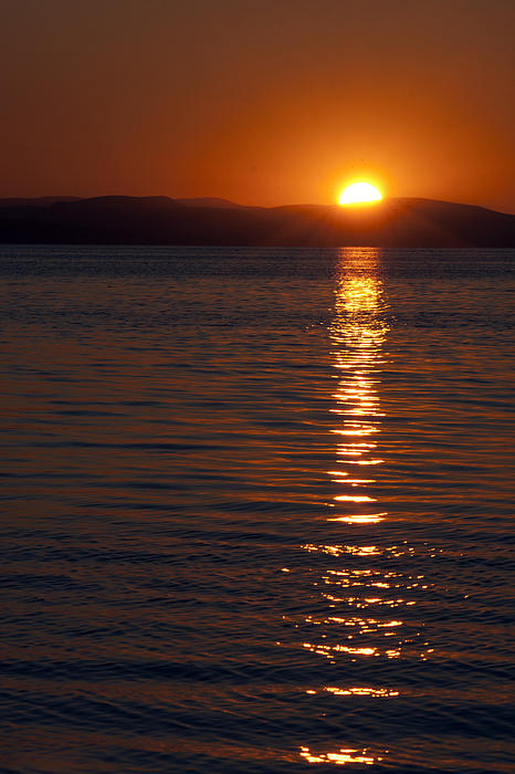 Sunset Water Reflections by Rico Besserdich