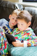 Two Boys Using A Digital Tablet #1 Photograph by Science Photo Library
