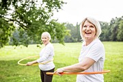Two Women With Plastic Hoops #1 Photograph by Science Photo Library