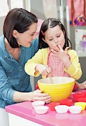 Mother And Daughter Baking #2 Photograph by Science Photo Library