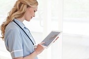 Nurse Using A Tablet Computer #6 Photograph by Science Photo Library