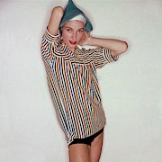 A Model Wearing Swimwear And A Striped Shirt Photograph by Clifford Coffin
