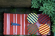 A Patio With Striped Umbrellas Photograph by James Mathews