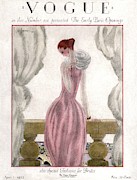 A Vogue Cover Of A Woman Wearing A Pink Dress Photograph by Georges Lepape