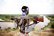 A Young Man Holds His Kalashnikov Rifle Photograph by Michael Hanson A Young Man Holds His Kalashnikov Rifle Photograph by Michael Hanson