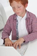 Boy Using Laptop Computer Photograph by Science Photo Library