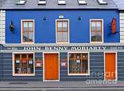 Brightly Colored Pub In Dingle, Ireland Photograph by John Shaw