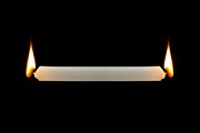 Burning the candle at both ends Photograph by Science Photo Library