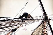 Climbing the rigging Photograph by Jeff Folger