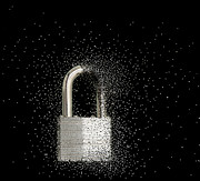 Close Up Of Padlock Dissolving Photograph by John M Lund Photography Inc