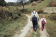 Farmer And Granddaughter, Montana, C Photograph by Bruce Roberts