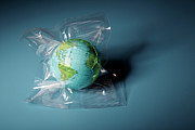 Globe Shrink Wrapped In Plastic Photograph by Henrik Weis