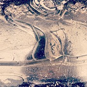 Ice on a puddle Photograph by Nic Squirrell