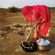 Indian Woman Getting Water From The Photograph by Hadynyah