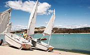 Kid rigging Optimist Photograph by Weston Westmoreland Kid rigging Optimist Photograph by Weston Westmoreland