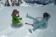 Models On Plastic Chairs With Snow In Switzerland Photograph by Arnaud de Rosnay