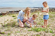 Mother With Children On Beach Photograph by Science Photo Library