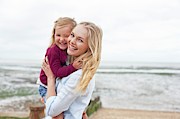 Mother With Daughter On Beach Photograph by Science Photo Library
