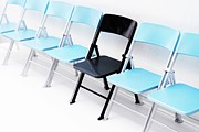 One Black Chair In A Row Of Blue Chairs Photograph by Science Photo Library