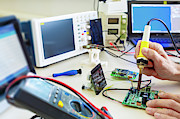 Person Working In An Electronics Lab Photograph by Science Photo Library