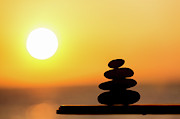 Pile Of Stone At Sunset Photograph by Science Photo Library