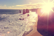 Port Campbell National Park Twelve Apostles with Sun Flare Photograph by Beverly Claire Kaiya