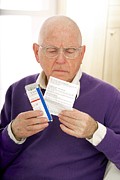 Reading Medical Drug Information Photograph by Science Photo Library