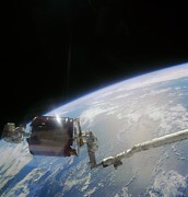 Retreival Of Damaged Communications Satellite. Photograph by Science Photo Library