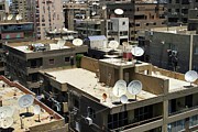 Satellite Dishes On City Rooftops Photograph by Science Photo Library