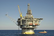 Spar type Oil Rig with Flare and Boat Photograph by Bradford Martin