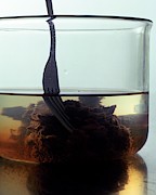 Tamarind Powder Floating In Water Photograph by Romulo Yanes
