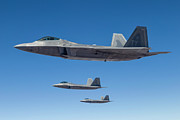 Three U.s. Air Force F-22 Raptors Photograph by Rob Edgcumbe/stocktrek Images