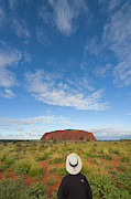 Tourist And Clouds At  Ayers Rock Photograph by Yva Momatiuk John Eastcott
