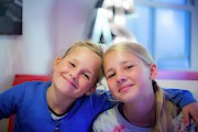 Two Girls Smiling Arms Around Each Other Photograph by Science Photo Library