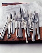 Various Forks On A Wooden Board Photograph by Romulo Yanes