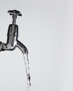 Water Flowing From A Tap Photograph by Science Photo Library