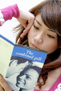 Woman Reading Contraception Information Photograph by Science Photo Library