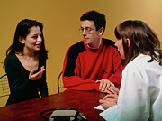 Young Couple In Consultation With Gp Doctor Photograph by Science Photo Library