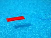 Pool - blue water and red inflatable mattress Photograph by Matthias Hauser