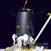 Three Crew Members Capture Intelsat Vi Photograph by Nasa