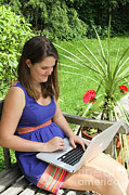 Woman Using Her Laptop Computer Photograph by Photo Researchers, Inc.