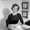 1950s Woman Sitting At Information Desk by Vintage Images 1950s Woman Sitting At Information Desk by Vintage Images