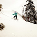 A Female Snowboarder Lays Out Some by Kyle Sparks A Female Snowboarder Lays Out Some by Kyle Sparks