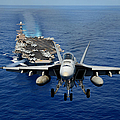 An F/A-18 Hornet demonstrates air power. Photograph by Sebastian Musial An F/A-18 Hornet demonstrates air power. Photograph by Sebastian Musial