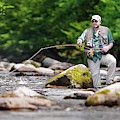 Fly Fisherman Stands Among Large by Corey Nolen Fly Fisherman Stands Among Large by Corey Nolen